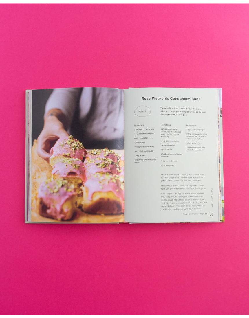 Open baking book showcasing pistachio-themed recipes from Brumby Sunstate's Pistachio Lover's Baking Book.