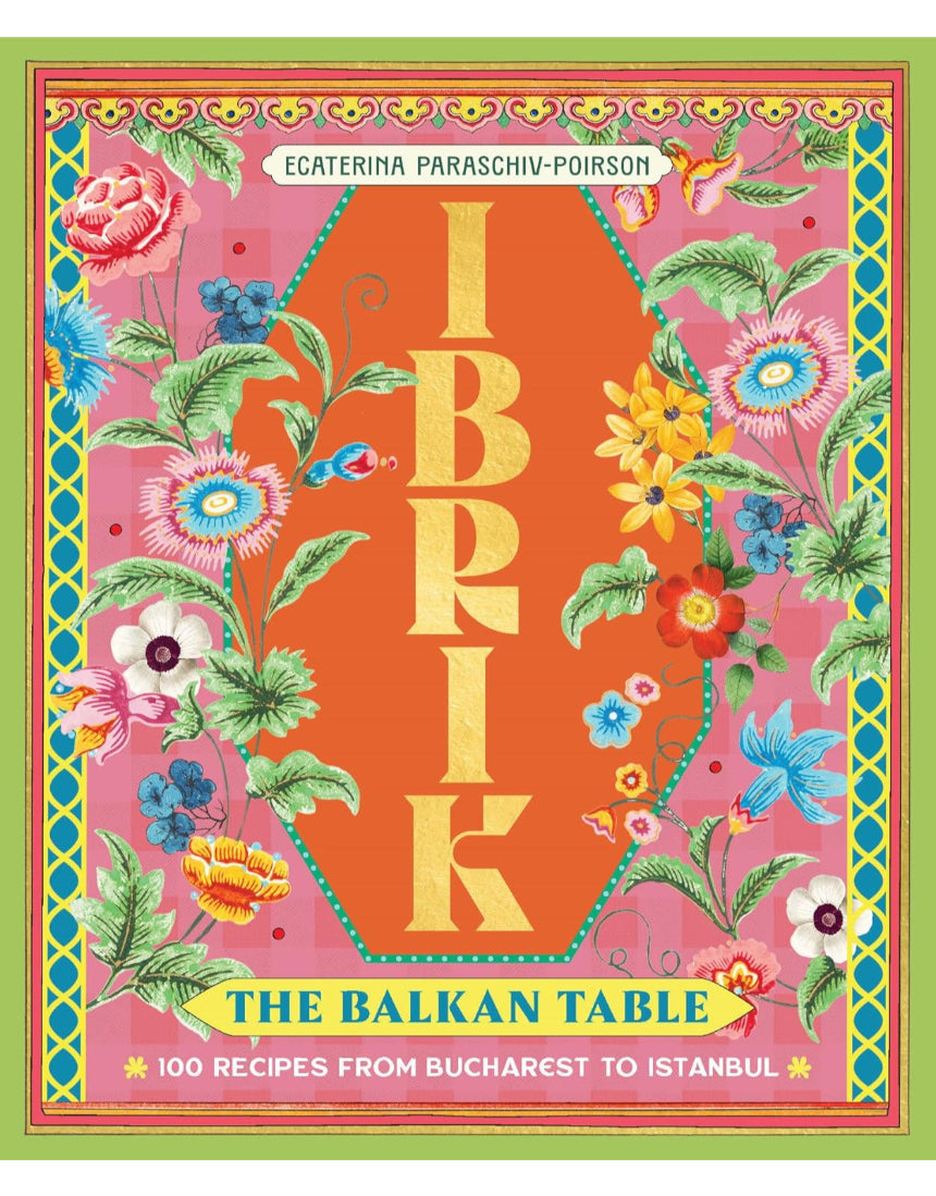 Ibrik coffee pot from Brumby Sunstate on a wooden table with a book titled "The Balkan Table" featuring 100 recipes from Bucharest to Istanbul.