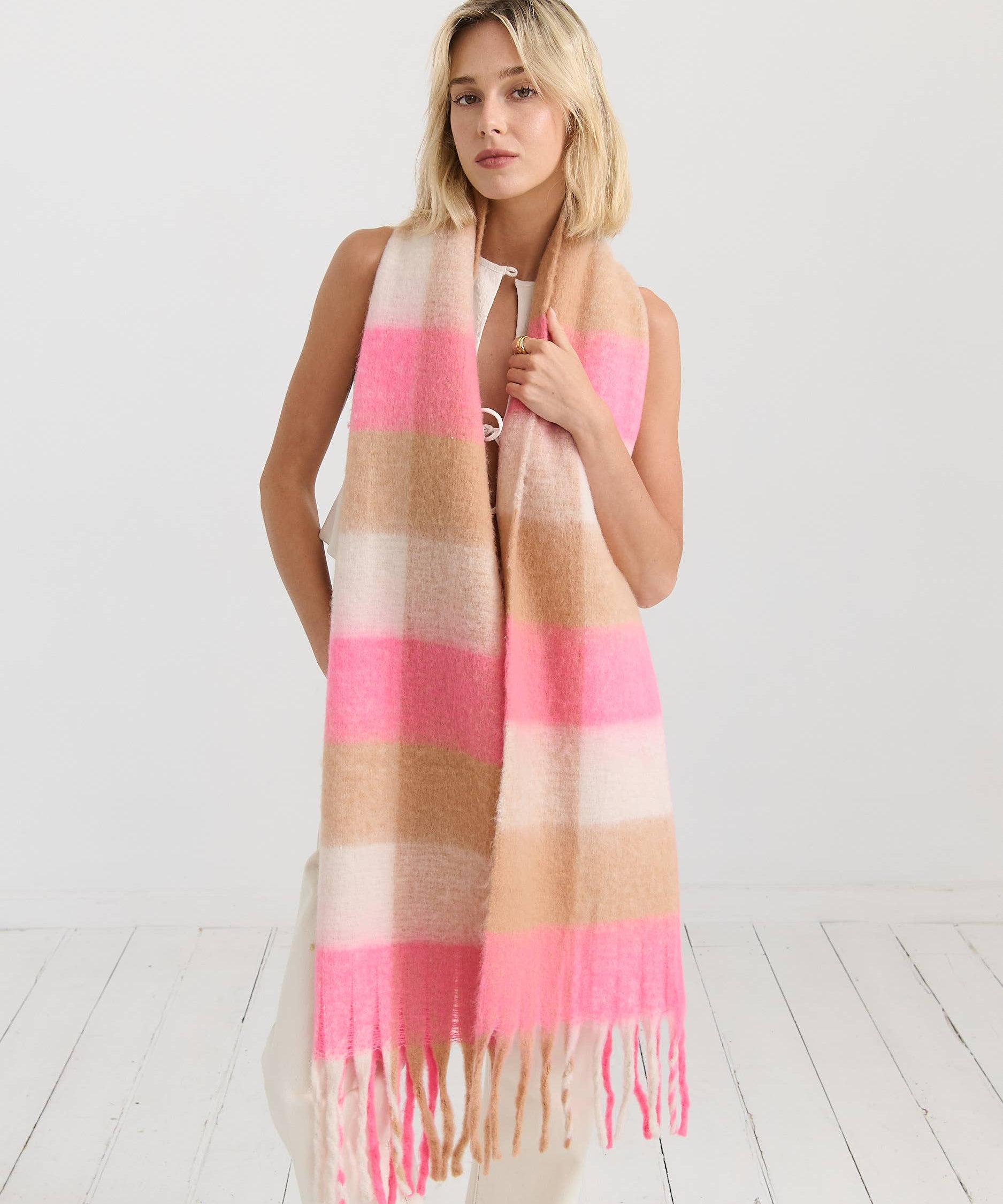 Neon pink checkered fluffy scarf by Angels Whisper Accessories, soft and stylish with a vibrant pattern and cozy texture.