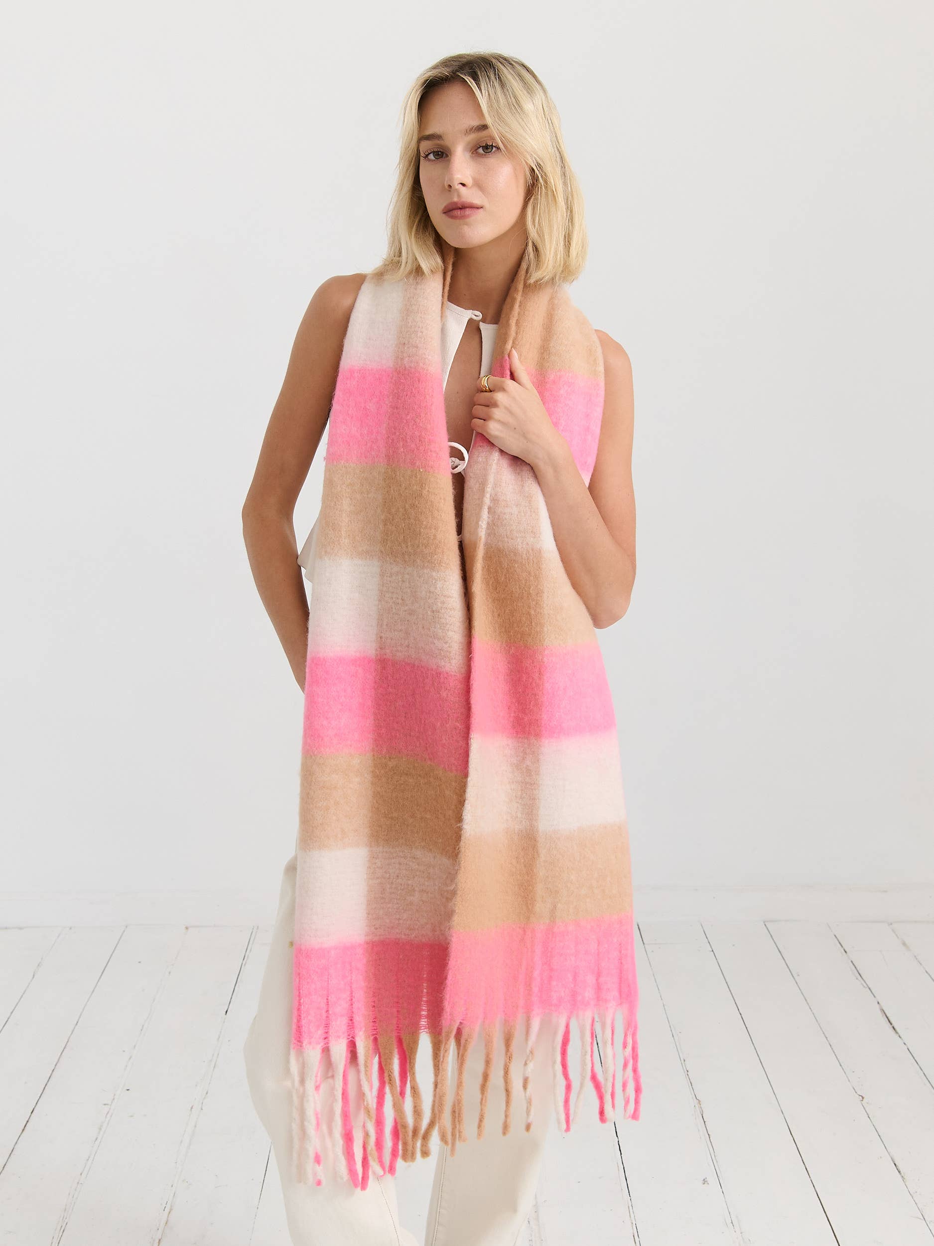 Neon pink checkered fluffy scarf by Angels Whisper Accessories, soft and stylish with a vibrant pattern and cozy texture.