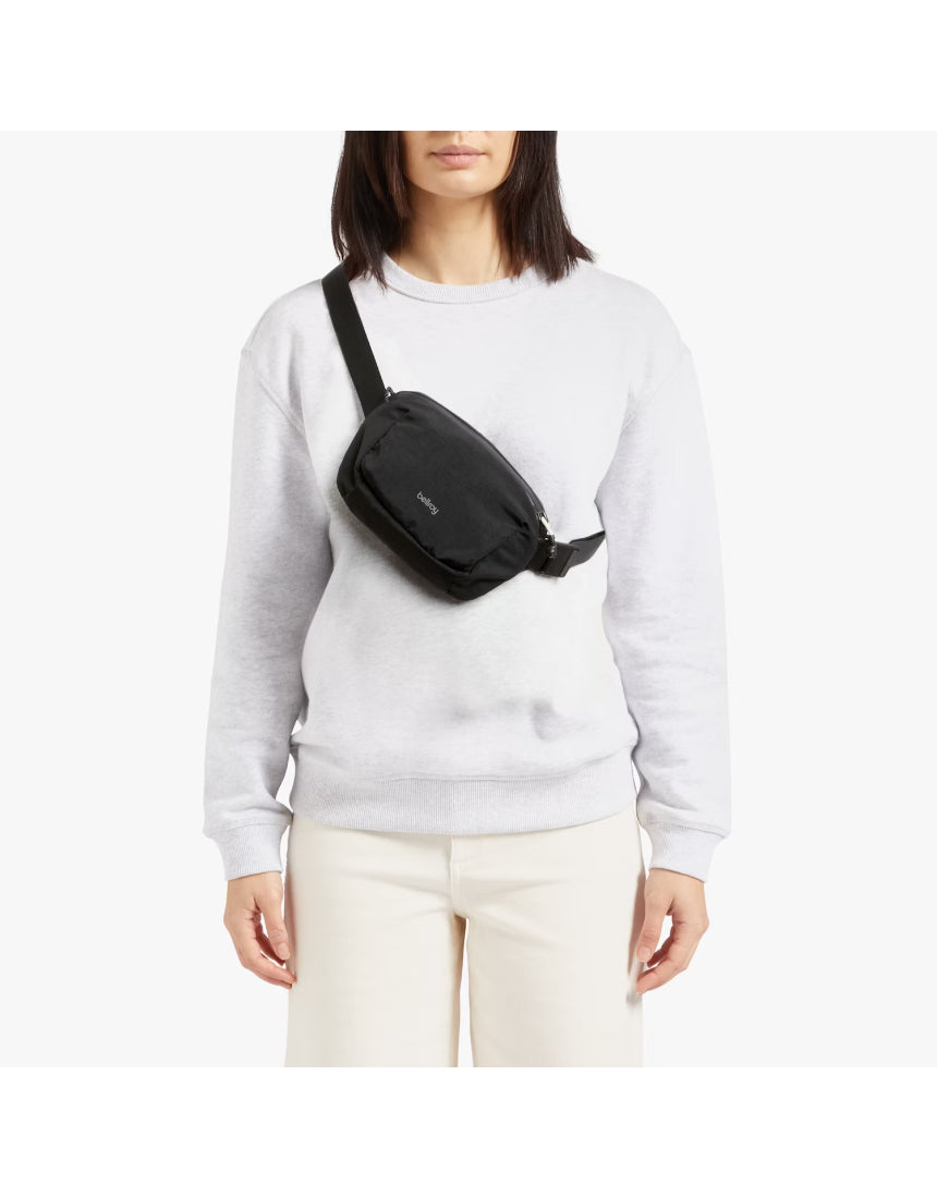 Black Bellroy Lite Belt Bag with adjustable strap and compact design, perfect for carrying essentials hands-free.