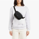 Black Bellroy Lite Belt Bag with adjustable strap and compact design, perfect for carrying essentials hands-free.
