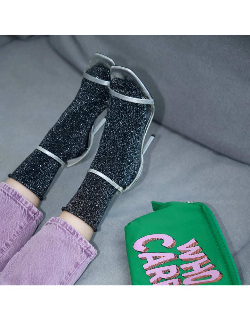 Black Glitter Lurex Socks by Klue, stylish socks with shimmering lurex fabric and a comfortable fit.