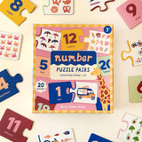 Lauren Sissons Studio Number Puzzle Pairs featuring colorful wooden number blocks arranged in matching pairs on a white background.