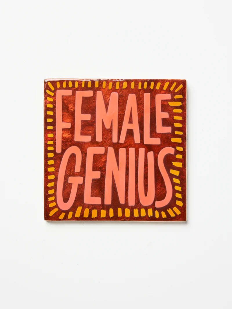 Jones & Co Superette Genius Tile wall decor with vibrant geometric patterns and bold colors on a white background.