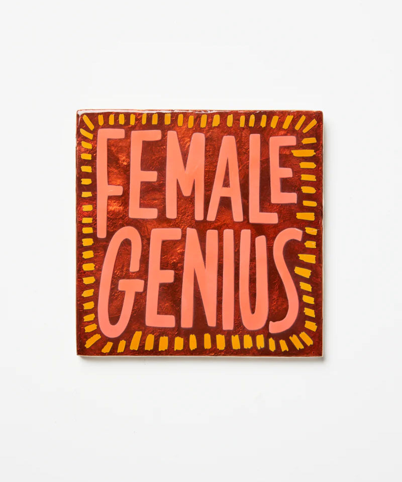 Jones & Co Superette Genius Tile wall decor with vibrant geometric patterns and bold colors on a white background.