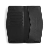 Black Fox & Leo Swallet backpack with adjustable straps and front pocket, featuring a sleek, modern design.