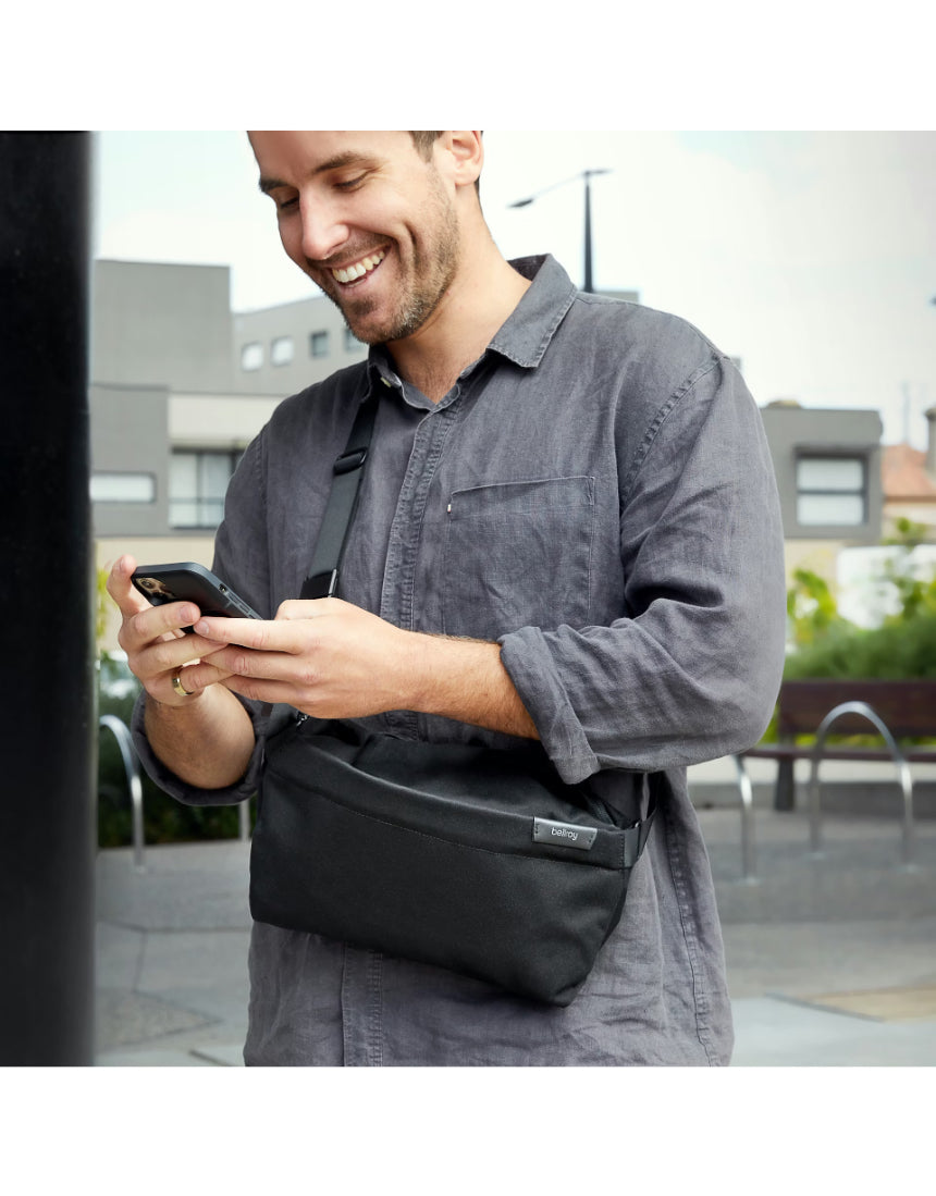 Bellroy Sling Bag in slate color, compact and stylish accessory with adjustable strap and multiple compartments.