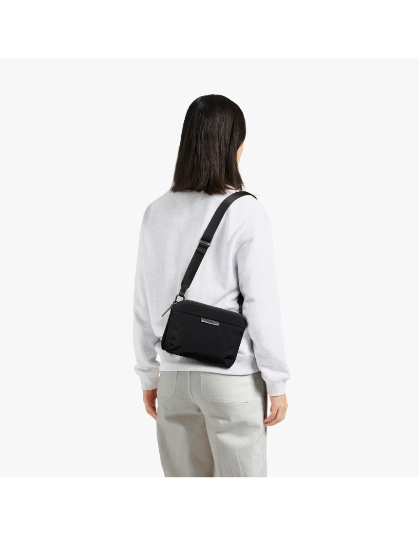 Bellroy Tokyo Side Bag in Raven, a sleek black crossbody bag with adjustable strap and minimalist design.