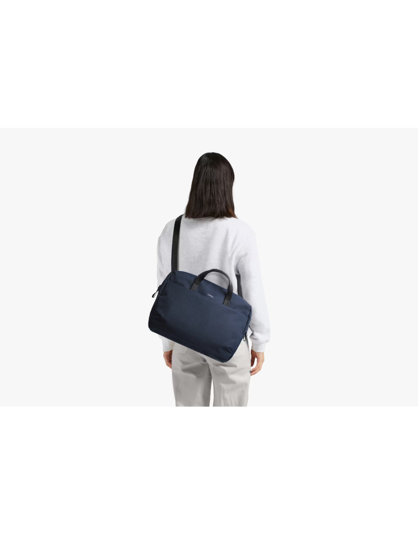 Bellroy Via Work Bag in navy with multiple compartments, padded shoulder strap, and sleek design for professional daily use.