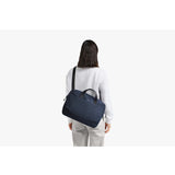 Bellroy Via Work Bag in navy with multiple compartments, padded shoulder strap, and sleek design for professional daily use.