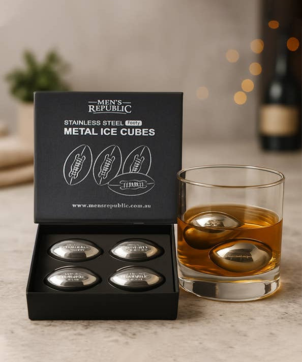 Men's Republic Footy Ball ice cubes set with four stainless steel balls for chilling drinks, displayed on a clear surface.