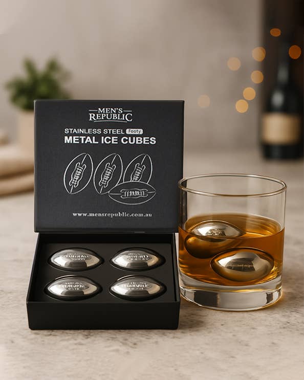 Men's Republic Footy Ball ice cubes set with four stainless steel balls for chilling drinks, displayed on a clear surface.