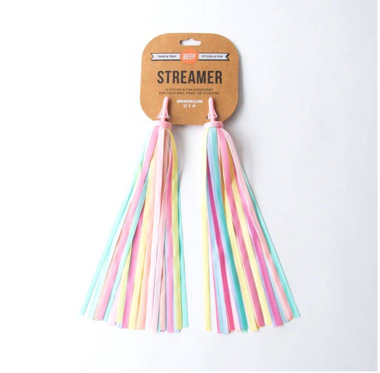 Beep pastel rainbow bike and scooter streamers with colorful fabric ribbons attached to a bicycle handlebar.