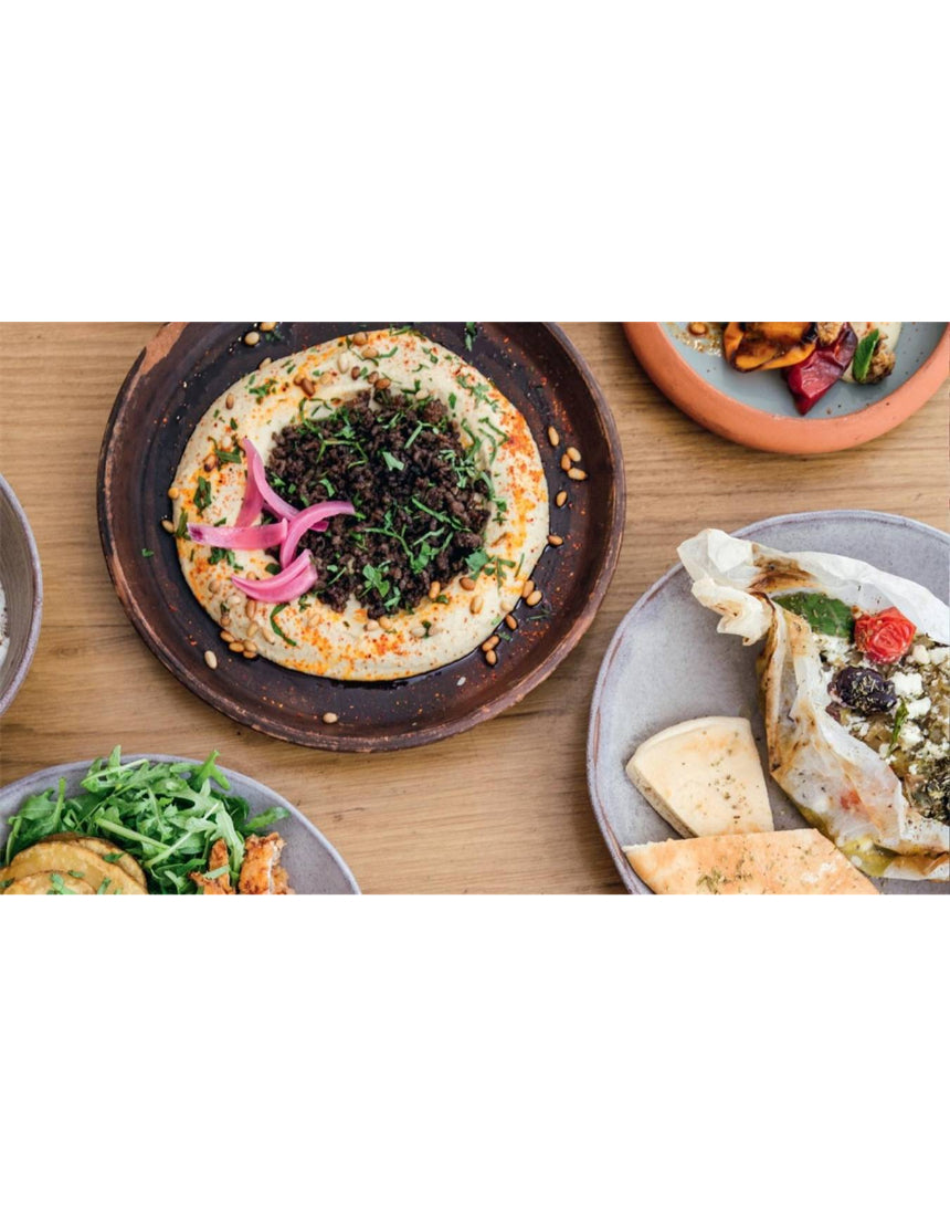Open book showing pages with Balkan and Middle Eastern recipes from "Ibrik: The Balkan Table" by Brumby Sunstate, featuring traditional dishes.