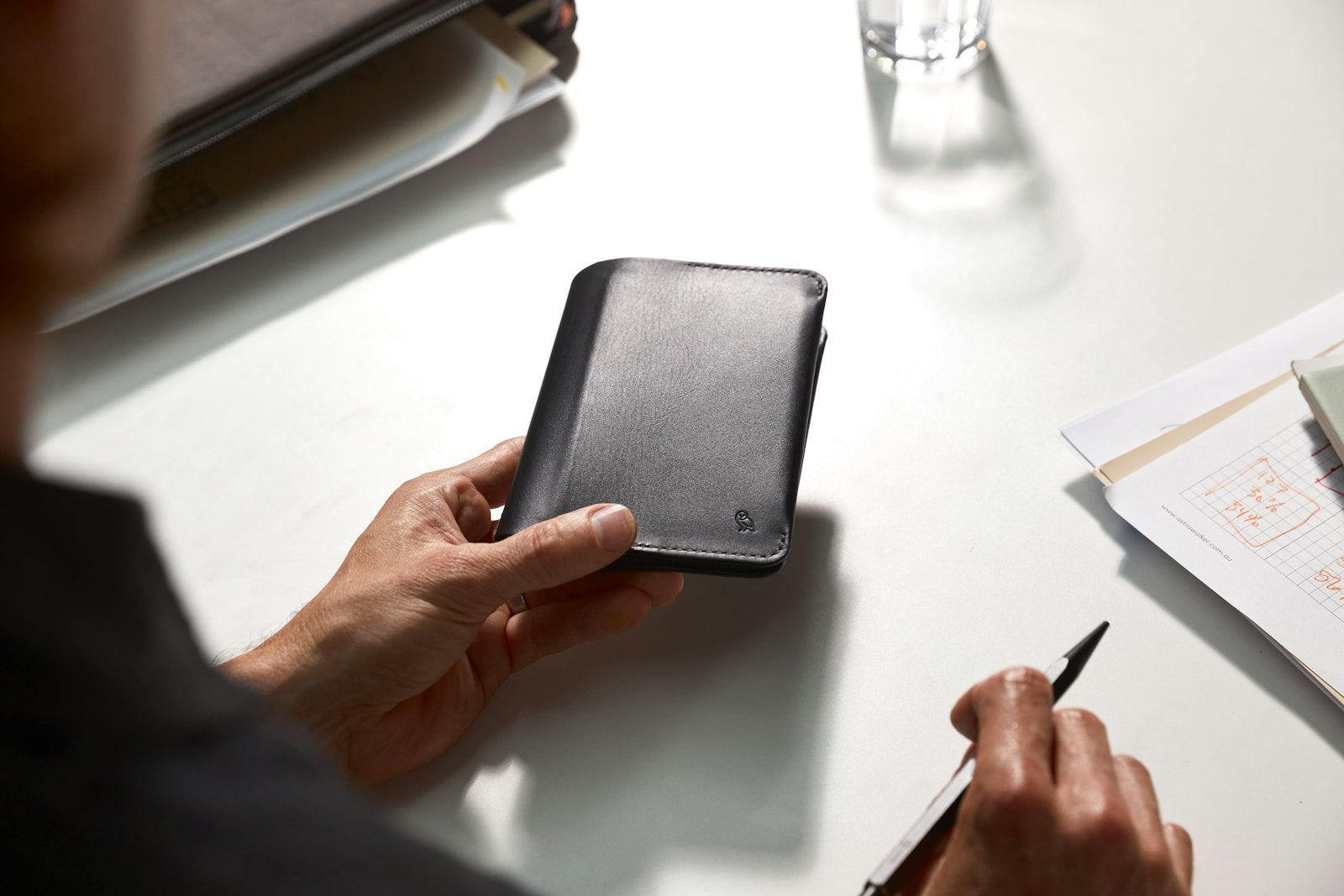 Black Bellroy notebook cover with sleek leather design, featuring subtle stitching and a minimalist closure.