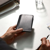 Black Bellroy notebook cover with sleek leather design, featuring subtle stitching and a minimalist closure.
