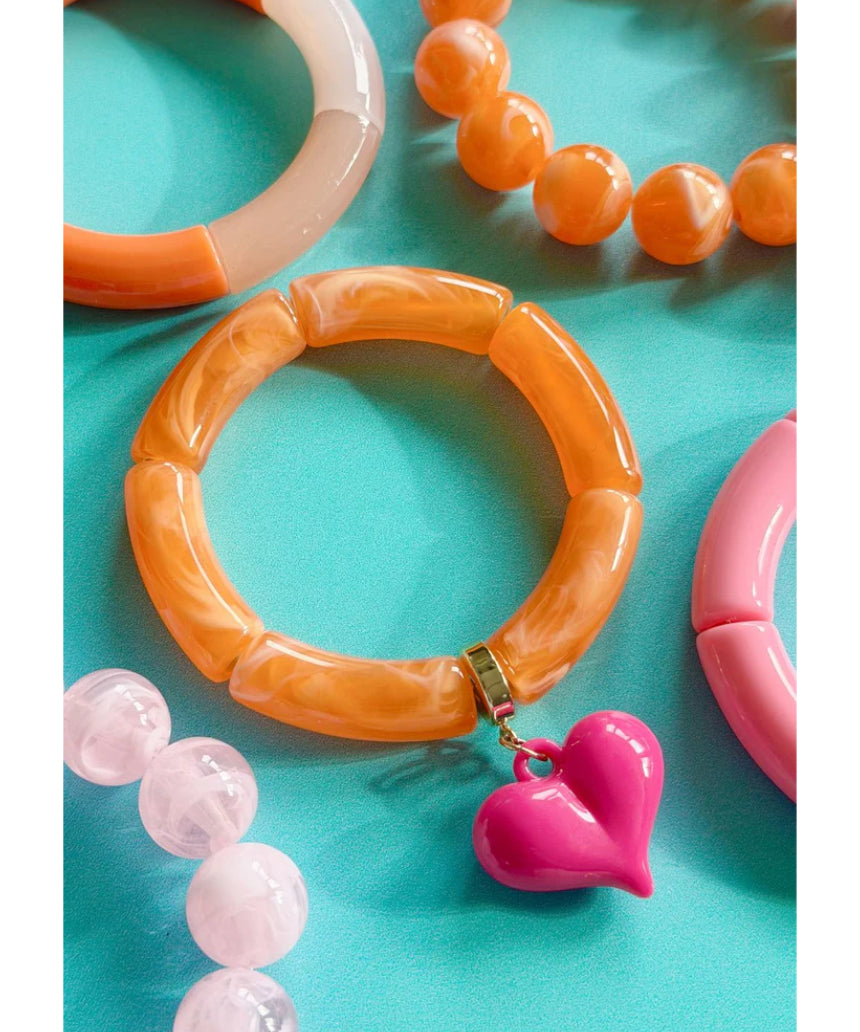 Mosk Melbourne Big Heart bracelet featuring a silver chain and a prominent heart charm on a white background.