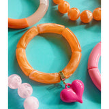 Mosk Melbourne Big Heart bracelet featuring a silver chain and a prominent heart charm on a white background.