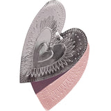 Reversible faux-tin heart bunting in light dusty pink by THE LITTLE PRESS, hanging with fabric and faux-tin heart shapes.