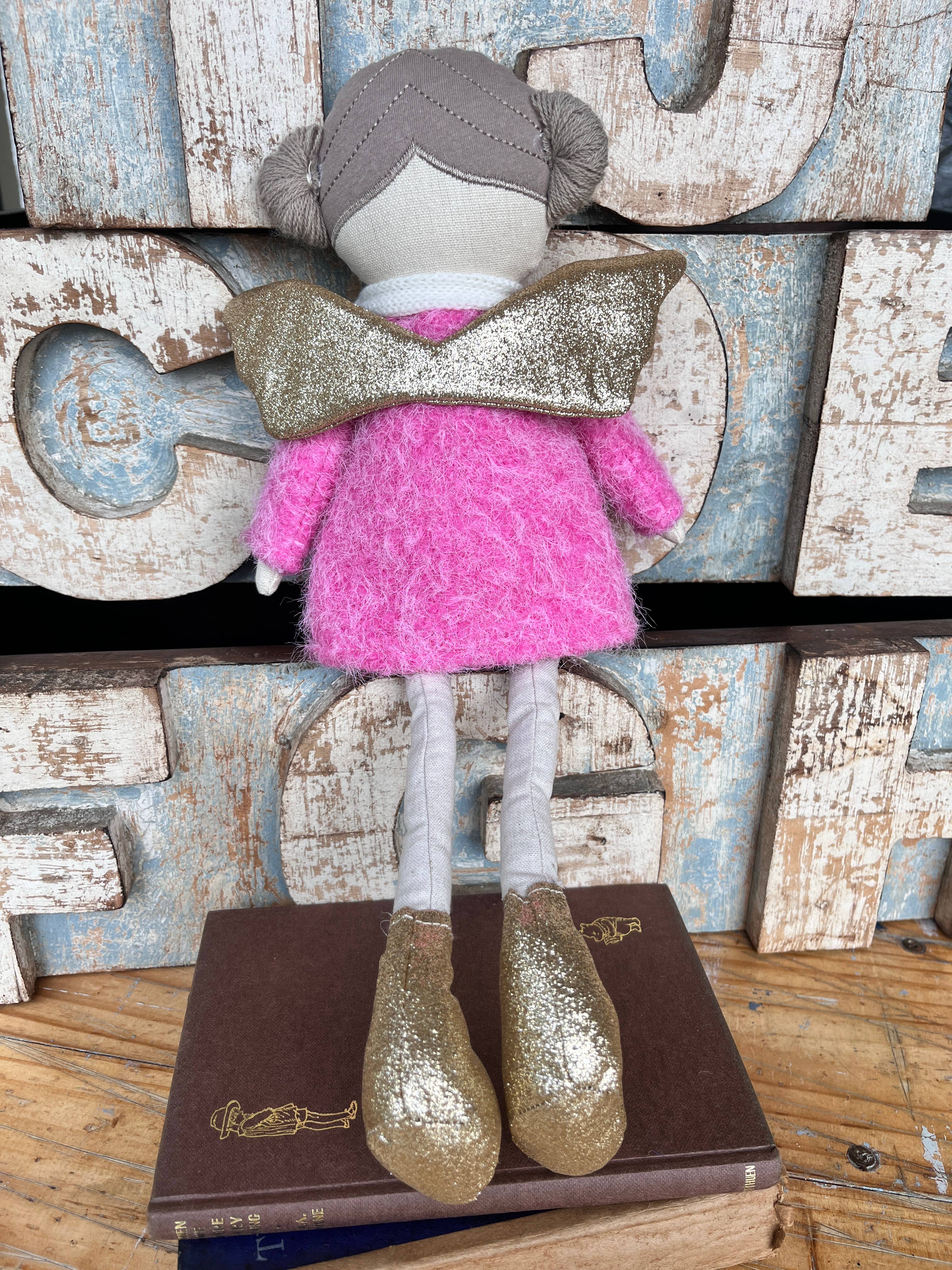 Amaranta Designs Bubblegum Doll with bright pink hair, colorful outfit, and playful expression, showcasing vibrant craftsmanship.