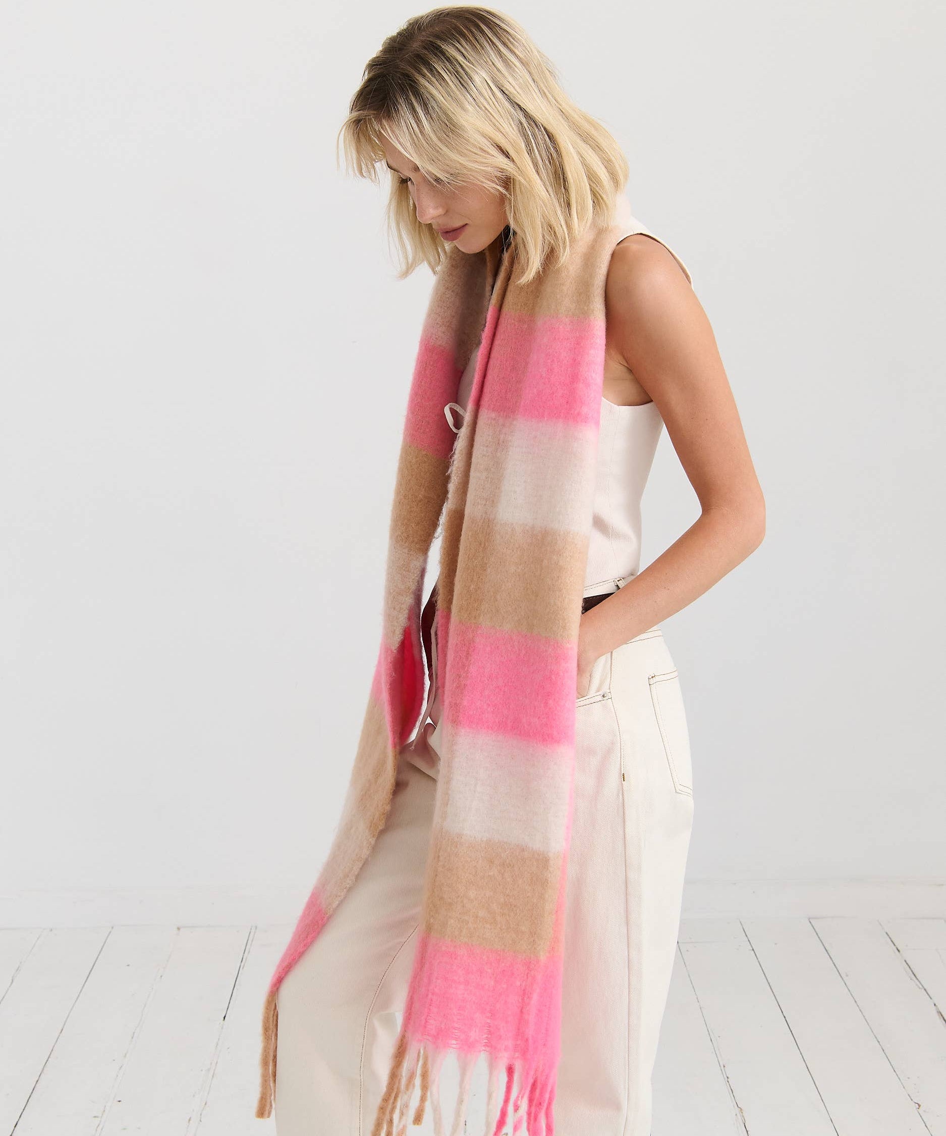 Neon pink checkered fluffy scarf by Angels Whisper Accessories, soft and stylish accessory with vibrant pattern and cozy texture.