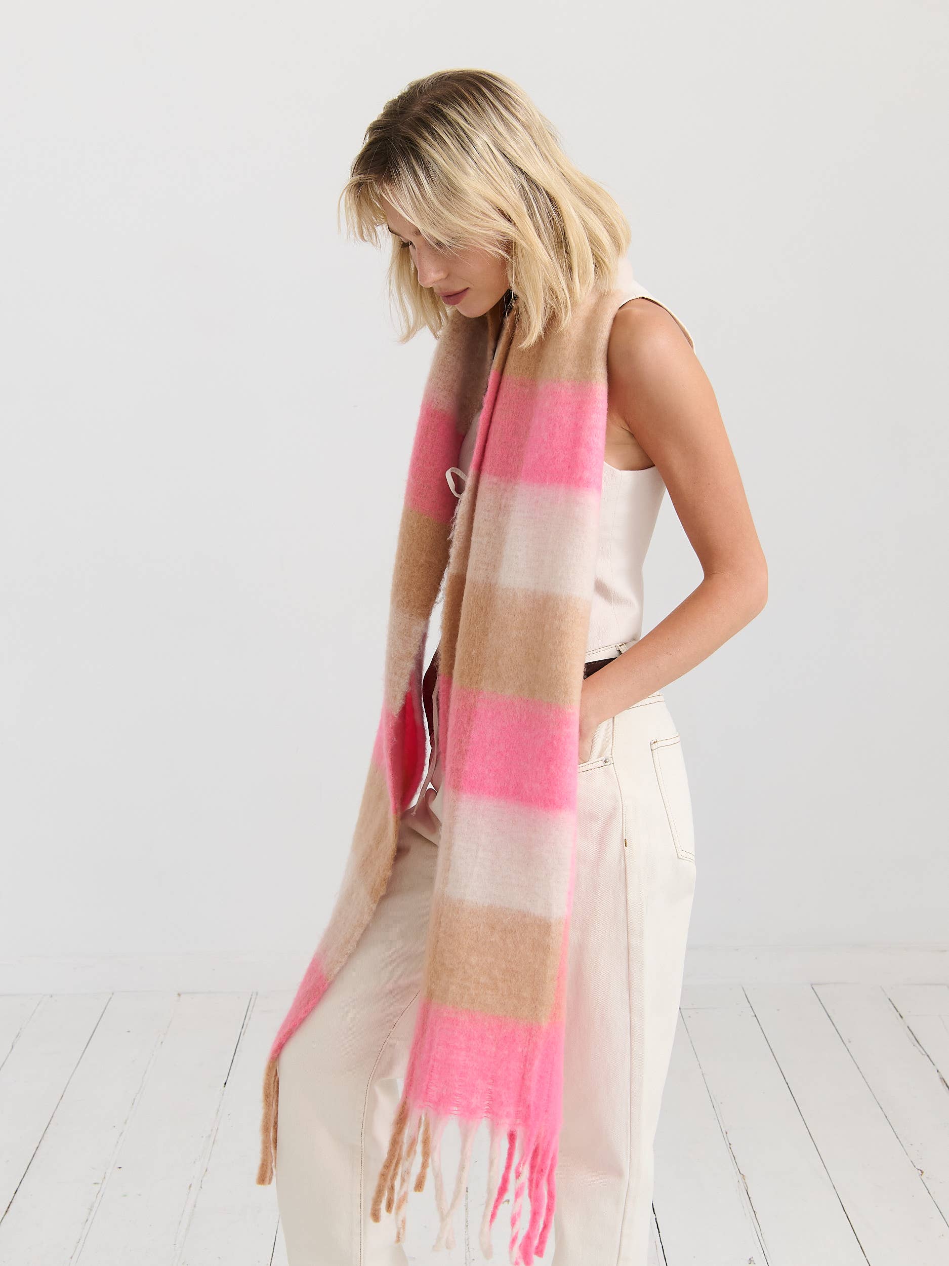 Neon pink checkered fluffy scarf by Angels Whisper Accessories, soft and stylish accessory with vibrant pattern and cozy texture.