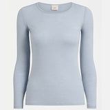 Elk Merino Long Sleeve Top in Pearl Blue, showcasing a soft, fitted wool shirt with long sleeves and a high neckline.