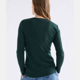 Elk Merino Long Sleeve Top in Dark Pine, soft wool clothing with a fitted design and crew neckline, ideal for layering.