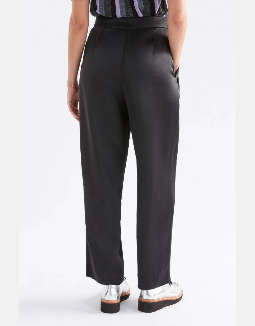 Black Elk Este Pants displayed on a model, featuring a slim fit and stylish design for casual or everyday wear.