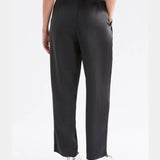 Black Elk Este Pants displayed on a model, featuring a slim fit and stylish design for casual or everyday wear.