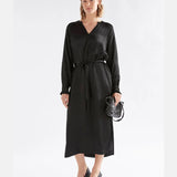 Elk Karta Dress, stylish women's clothing in a relaxed fit with a floral pattern, shown on a model.