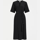 Black Elk Kysten Dress, a stylish women's clothing item with a relaxed fit, displayed on a hanger.