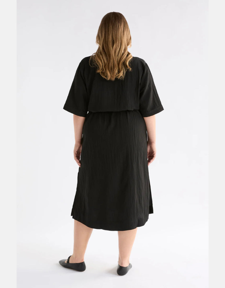 Black Elk Kysten Dress, stylish women's clothing with flowy fabric and elegant design, shown on a model.