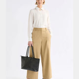 Elk Kudel Pant in almond color, stylish clothing with a relaxed fit and tapered design, made from comfortable fabric.