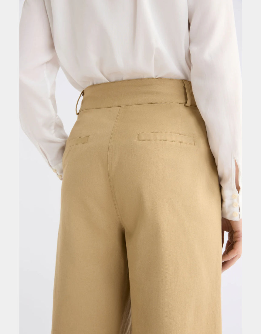Elk Kudel Pant in almond color, stylish clothing with a relaxed fit, shown on a model featuring comfortable fabric and modern design.