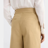 Elk Kudel Pant in almond color, stylish clothing with a relaxed fit, shown on a model featuring comfortable fabric and modern design.