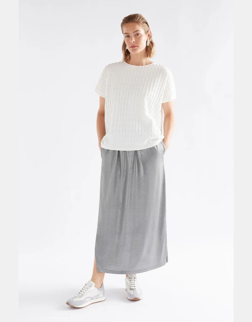 Silver Elk Maail skirt displayed on a hanger, showcasing its stylish design and fabric details.