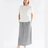 Silver Elk Maail skirt displayed on a hanger, showcasing its stylish design and fabric details.