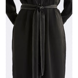 Black Elk Famke Dress, stylish women's clothing with a flattering fit, shown on a model.