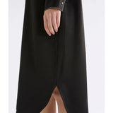 Black Elk Famke Dress, stylish women's clothing with a flattering fit, shown on a model in a natural pose.