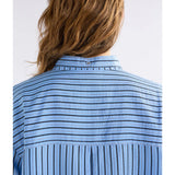 Elk Hedi Shirt in chambray stripe with a classic collar, button-front, and long sleeves, displayed on a neutral background.