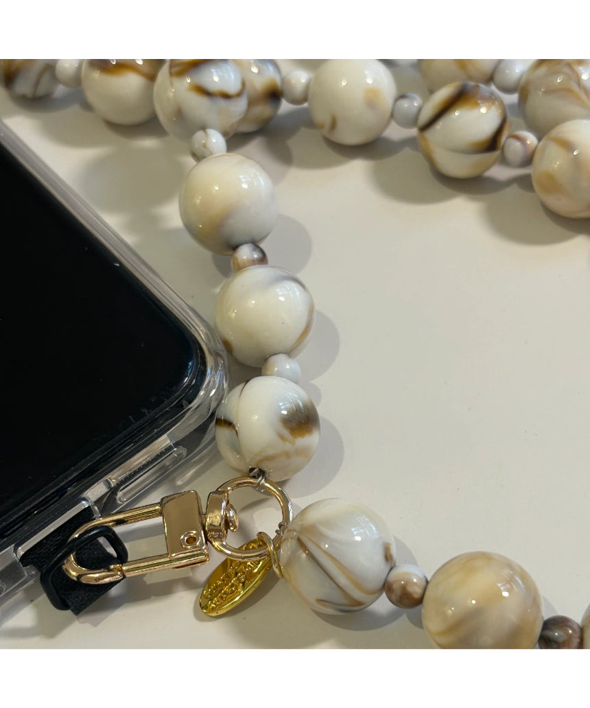 Salty Safari Bella Cross Body Phone Holder accessory with adjustable strap and compact design for hands-free convenience.