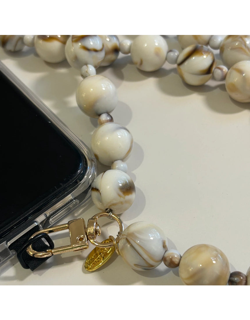 Salty Safari Bella Cross Body Phone Holder accessory with adjustable strap and compact design for hands-free convenience.