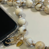 Salty Safari Bella Cross Body Phone Holder accessory with adjustable strap and compact design for hands-free convenience.