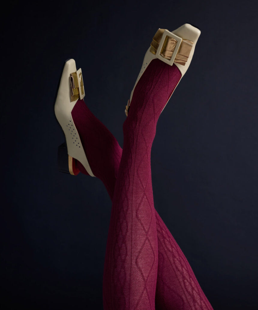 Close-up of Tightology Aran Cashmere Blend Tights in claret, showcasing their soft knit texture and comfortable fit.