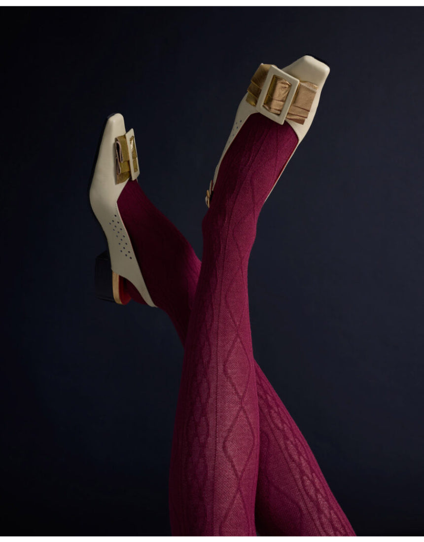 Close-up of Tightology Aran Cashmere Blend Tights in claret, showcasing their soft knit texture and comfortable fit.