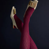 Close-up of Tightology Aran Cashmere Blend Tights in claret, showcasing their soft knit texture and comfortable fit.