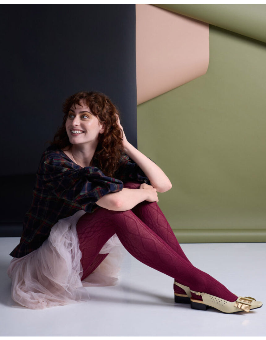 Aran Cashmere Blend Tights by Tightology in claret color, featuring a close-up of the soft, textured knit fabric and snug fit.