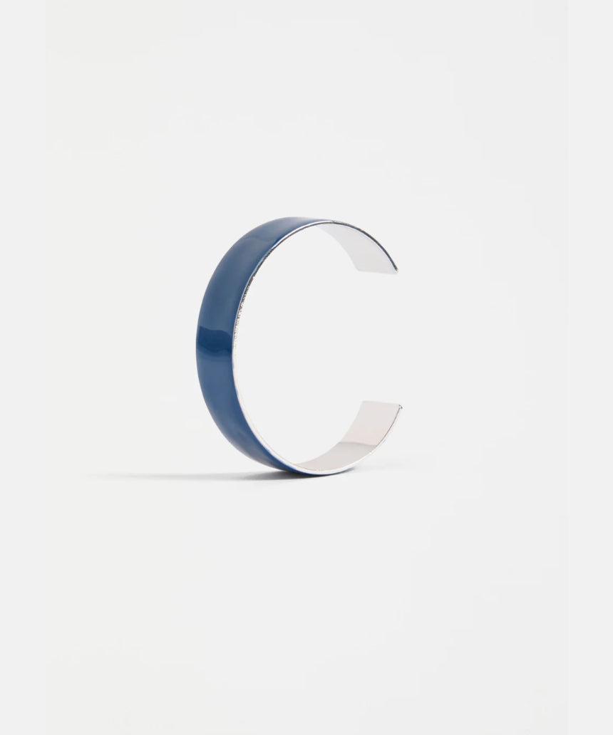 Elk Innfellt Thin Bangle bracelet in denim blue with a sleek, minimalist design on a plain background.